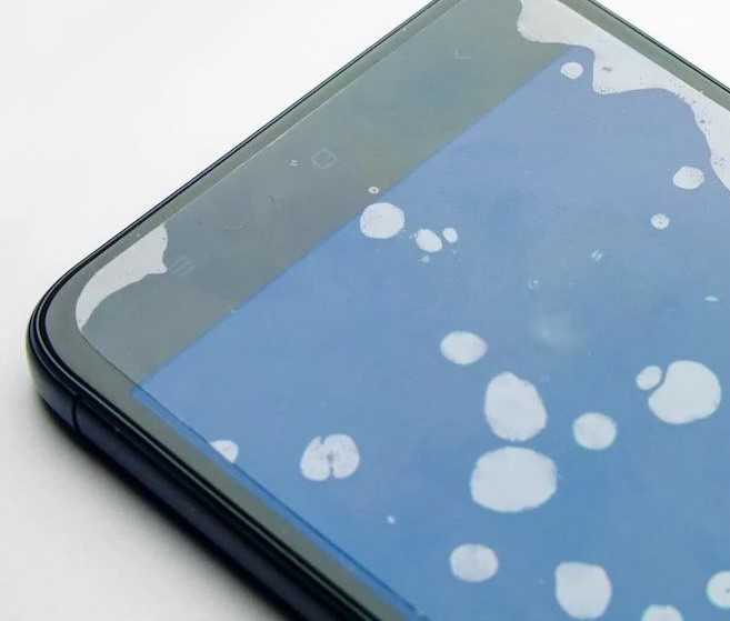 Aardvark Marketing | Upgrade your screen protector | image of bubbles under a mobile phone screen protectorge of CNC machining